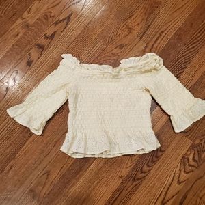 Bright yellow ribbed crop top.